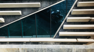 Modern building facade with angular windows and parallel ledges